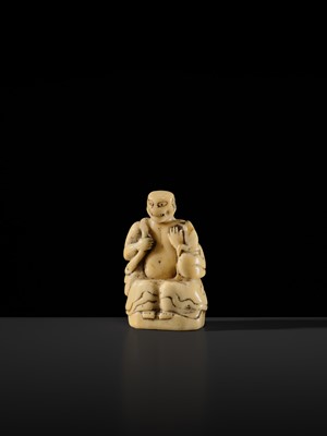 Lot 76 - A LARGE AND UNUSUAL SOLID WALRUS TUSK NETSUKE OF GAMA SENNIN