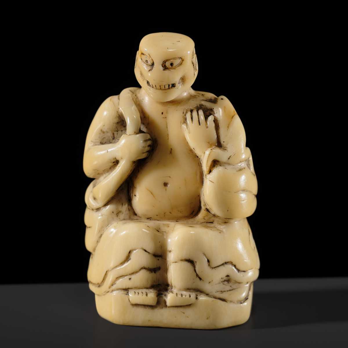 Lot 76 - A LARGE AND UNUSUAL SOLID WALRUS TUSK NETSUKE OF GAMA SENNIN