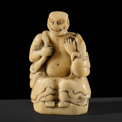 Lot 76 - A LARGE AND UNUSUAL SOLID WALRUS TUSK NETSUKE OF GAMA SENNIN
