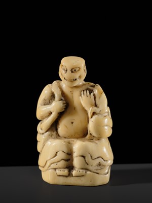 Lot 76 - A LARGE AND UNUSUAL SOLID WALRUS TUSK NETSUKE OF GAMA SENNIN