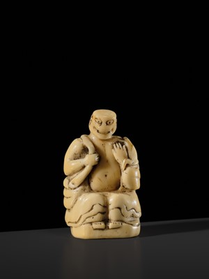 Lot 76 - A LARGE AND UNUSUAL SOLID WALRUS TUSK NETSUKE OF GAMA SENNIN