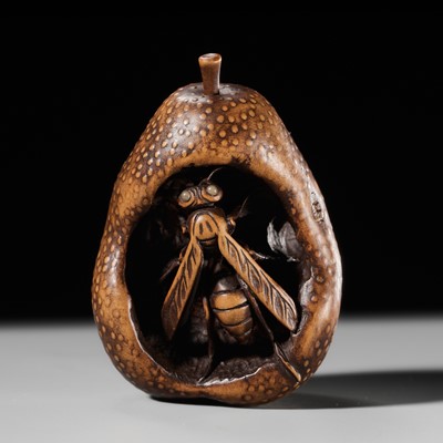 Lot 496 - KOGETSU: A FINE NAGOYA SCHOOL NETSUKE OF A WASP INSIDE A DECAYING PEAR