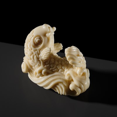 Lot 283 - SOKO: A SUPERB SO-SCHOOL IVORY NETSUKE OF A CARP IN WAVES