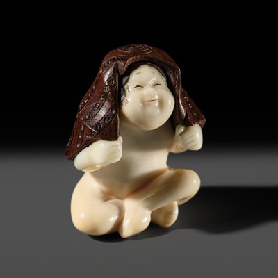 Lot 284 - SOSUI: A SUPERB SO-SCHOOL IVORY AND WOOD NETSUKE OF OKAME WITH A BATH TOWEL