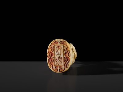 Lot 98 - A SUPERB IVORY SEAL-TYPE (INGYO) NETSUKE OF A KIRIN