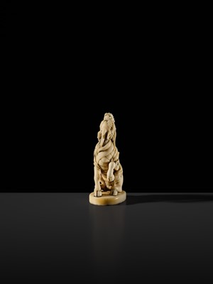 Lot 98 - A SUPERB IVORY SEAL-TYPE (INGYO) NETSUKE OF A KIRIN