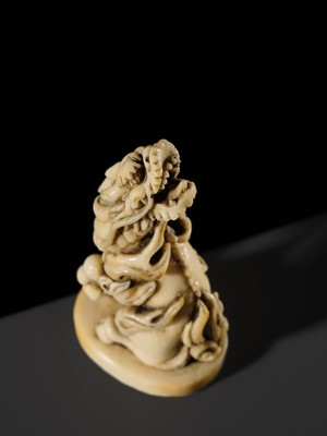 Lot 98 - A SUPERB IVORY SEAL-TYPE (INGYO) NETSUKE OF A KIRIN