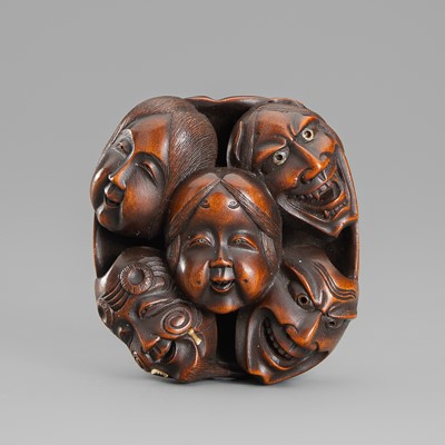 Lot 636 - A FINE INLAID BOXWOOD NETSUKE DEPICTING A GROUP OF MASKS