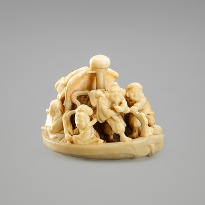 Lot 637 - AN IVORY NETSUKE DEPICTING THE SEVEN LUCKY GODS ON THE TAKARUBUNE (TREASURE BOAT)