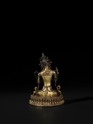 Lot 15 - A GILT COPPER-ALLOY FIGURE OF VAJRADHARA, TIBET, CIRCA 15TH CENTURY