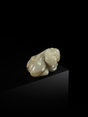 A CELADON JADE CARVING OF A BUDDHIST LION, LATE MING TO EARLY QING DYNASTY