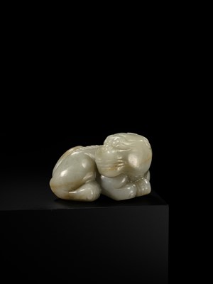 A CELADON JADE CARVING OF A BUDDHIST LION, LATE MING TO EARLY QING DYNASTY