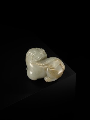 A CELADON JADE CARVING OF A BUDDHIST LION, LATE MING TO EARLY QING DYNASTY