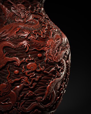 Lot 397 - AN IMPERIAL ‘NINE DRAGONS’ CINNABAR LACQUER BALUSTER VASE, QING DYNASTY