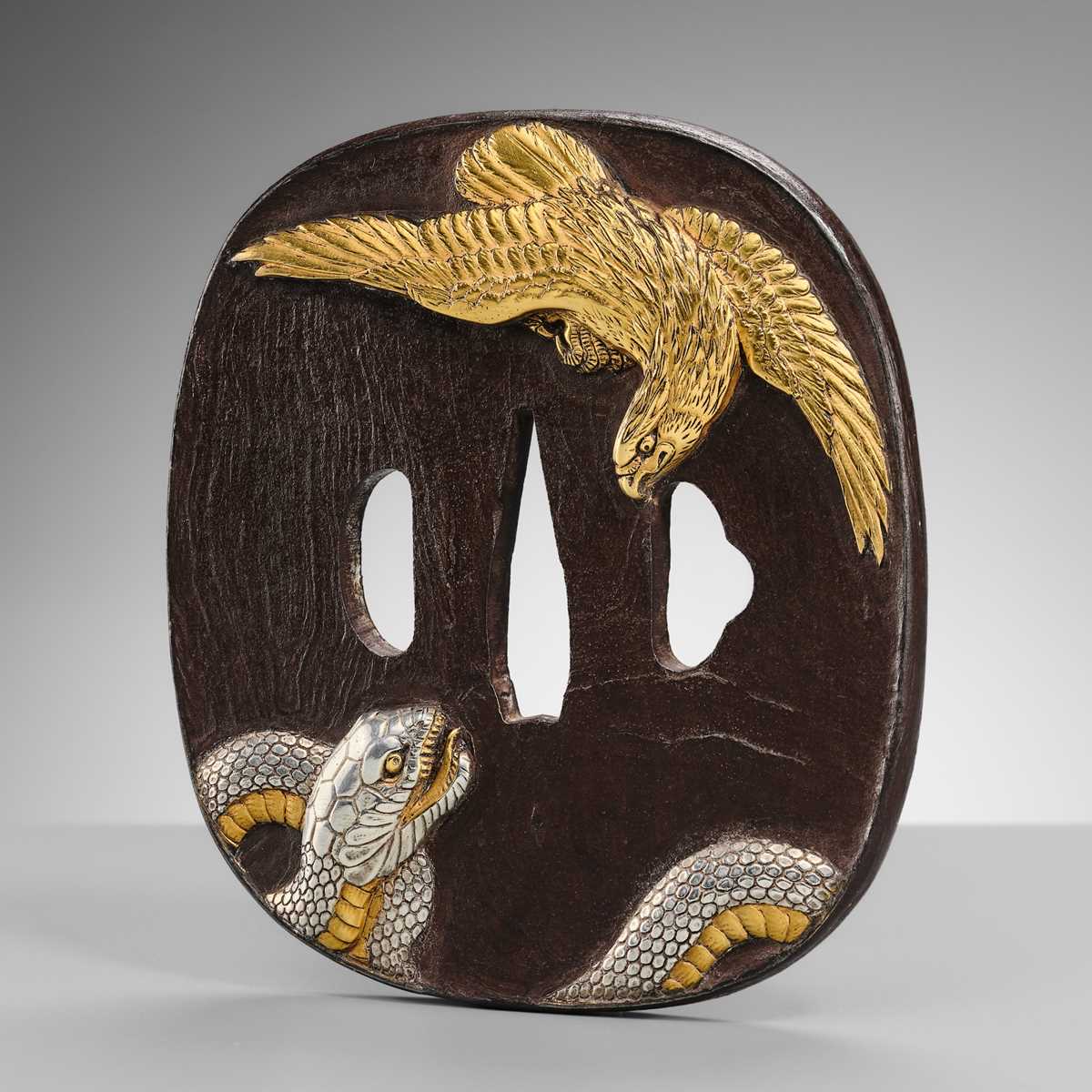 Lot 57 - A SUPERB AND LARGE BAKUMATSU IRON TSUBA WITH A GOLD EAGLE AND SILVER SNAKE