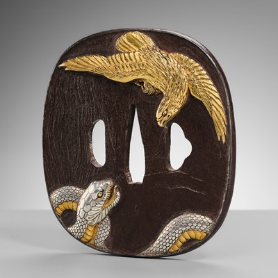 Lot 57 - A SUPERB AND LARGE BAKUMATSU IRON TSUBA WITH A GOLD EAGLE AND SILVER SNAKE