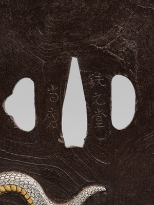 Lot 57 - A SUPERB AND LARGE BAKUMATSU IRON TSUBA WITH A GOLD EAGLE AND SILVER SNAKE