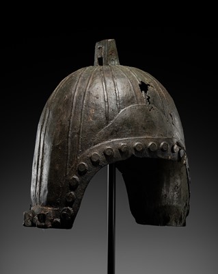 Lot 844 - AN ARCHAISTIC BRONZE HELMET, WESTERN ZHOU STYLE