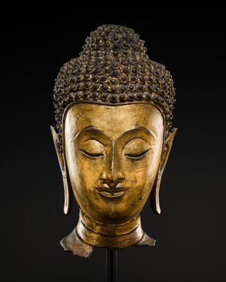 Lot 435 - A GILT-BRONZE HEAD OF BUDDHA, AYUTTHAYA PERIOD, 17TH-18TH CENTURY