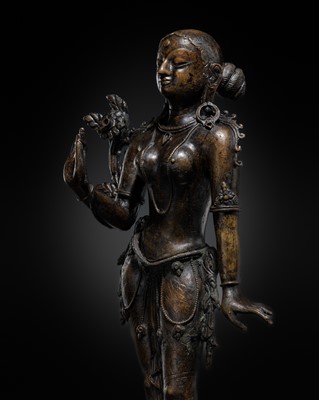 Lot 40 - A LARGE BRONZE FIGURE OF TARA, NEPAL, CIRCA 17TH-18TH CENTURY