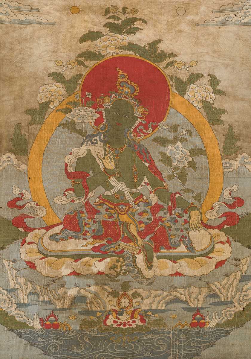 Lot 43 - A SILK EMBROIDERED THANGKA OF GREEN TARA, 18TH-19TH CENTURY