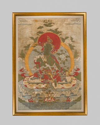 Lot 43 - A SILK EMBROIDERED THANGKA OF GREEN TARA, 18TH-19TH CENTURY