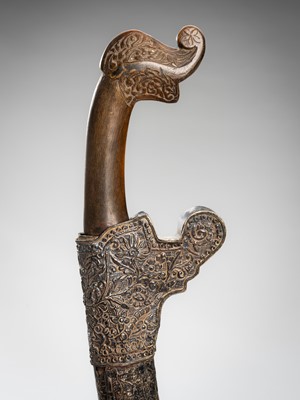 Lot 1380 - A HORN AND SILVER-ALLOY REPOUSSÉ DAGGER (GOLOK OR PEDANG), 19TH CENTURY