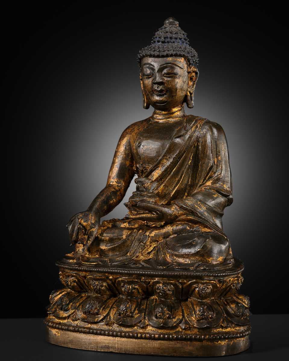 Lot 60 - A GILT-LACQUERED BRONZE FIGURE OF THE MEDICINE BUDDHA, BHAISHAJYAGURU, MING DYNASTY