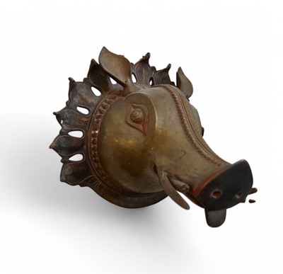 Lot 315 - A BRONZE BHUTA MASK IN THE FORM OF A PANJURLI BHUTA (BOAR SPIRIT DEITY), TULU NADU, 18TH-19TH CENTURY
