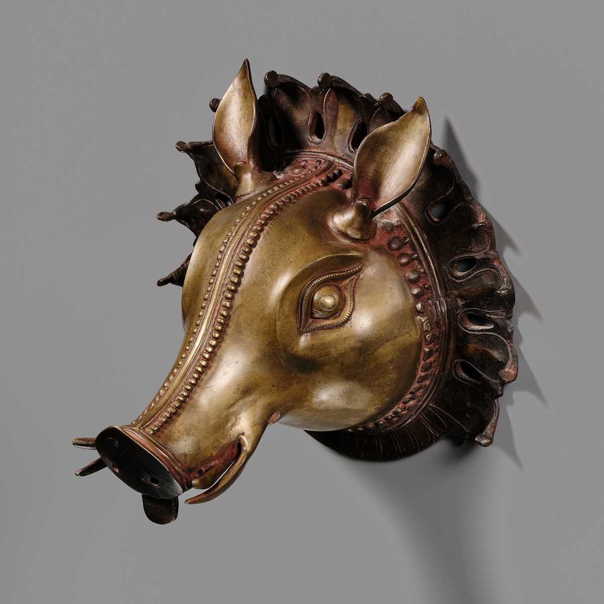 Lot 315 - A BRONZE BHUTA MASK IN THE FORM OF A PANJURLI BHUTA (BOAR SPIRIT DEITY), TULU NADU, 18TH-19TH CENTURY