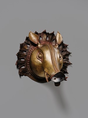 Lot 315 - A BRONZE BHUTA MASK IN THE FORM OF A PANJURLI BHUTA (BOAR SPIRIT DEITY), TULU NADU, 18TH-19TH CENTURY
