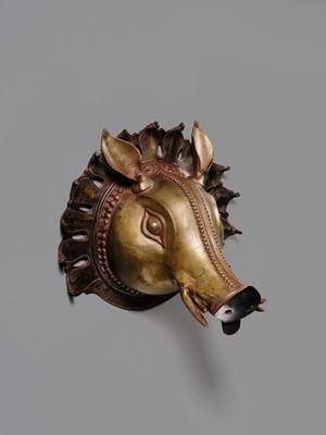 Lot 315 - A BRONZE BHUTA MASK IN THE FORM OF A PANJURLI BHUTA (BOAR SPIRIT DEITY), TULU NADU, 18TH-19TH CENTURY