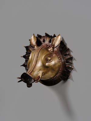 Lot 315 - A BRONZE BHUTA MASK IN THE FORM OF A PANJURLI BHUTA (BOAR SPIRIT DEITY), TULU NADU, 18TH-19TH CENTURY
