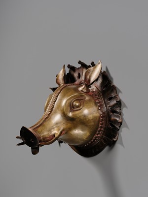 Lot 315 - A BRONZE BHUTA MASK IN THE FORM OF A PANJURLI BHUTA (BOAR SPIRIT DEITY), TULU NADU, 18TH-19TH CENTURY