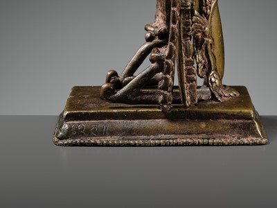 A GILT-BRONZE CAST AND REPOUSSÉ ISHTADEVATA SHRINE, NEPAL, DATED 1824