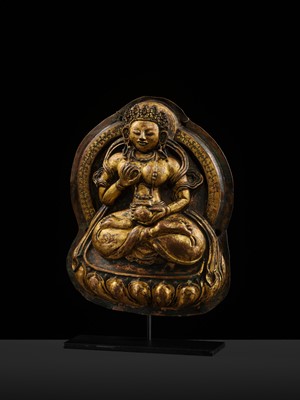 Lot 18 - A GILT-COPPER REPOUSSÉ PLAQUE OF WHITE TARA, TIBET, 18TH CENTURY