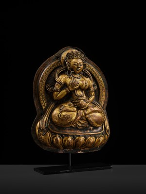 Lot 18 - A GILT-COPPER REPOUSSÉ PLAQUE OF WHITE TARA, TIBET, 18TH CENTURY