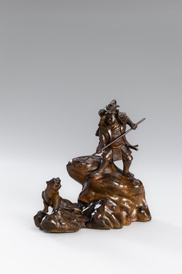 Lot 32 - A BRONZE OKIMONO OF A SAMURAI HUNTING A TIGER