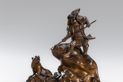 Lot 32 - A BRONZE OKIMONO OF A SAMURAI HUNTING A TIGER