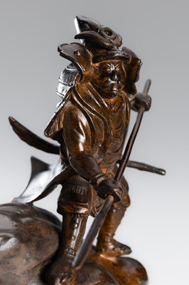 Lot 32 - A BRONZE OKIMONO OF A SAMURAI HUNTING A TIGER