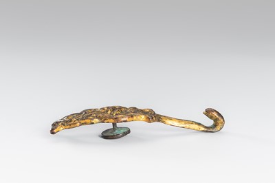 TWO ARCHAISTIC GILT-BRONZE ‘MYTHICAL BEAST’ BELT HOOKS