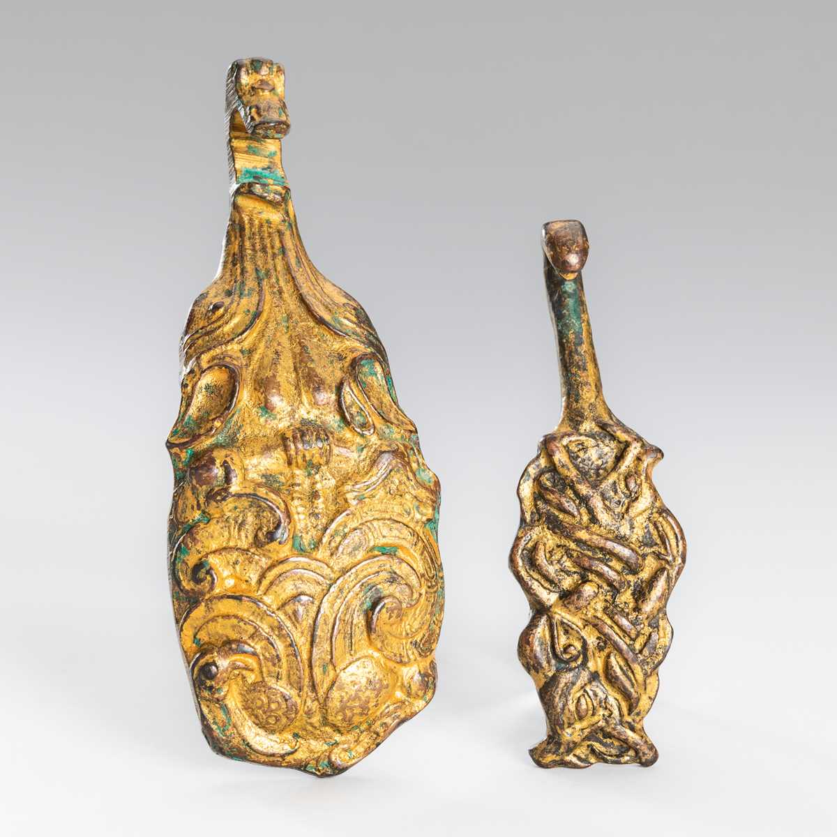 TWO ARCHAISTIC GILT-BRONZE ‘MYTHICAL BEAST’ BELT HOOKS