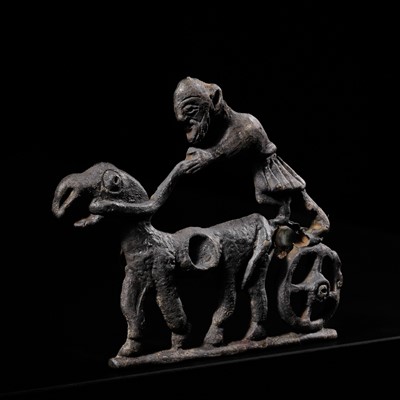 Lot 313 - A SILVER HORSE BIT CHEEK PIECE IN THE FORM OF A CHARIOT, LURISTAN, CIRCA 10TH-7TH CENTURY BC