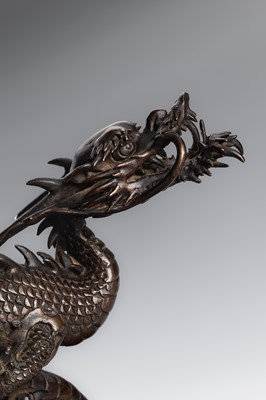 Lot 30 - A BRONZE KORO COVER WITH A DRAGON AMID CRASHING WAVES