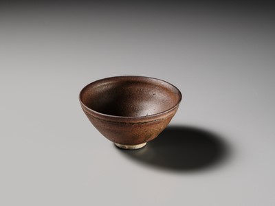 Lot 229 - A JIAN PERSIMMON-GLAZED STONEWARE TEA BOWL, SONG DYNASTY