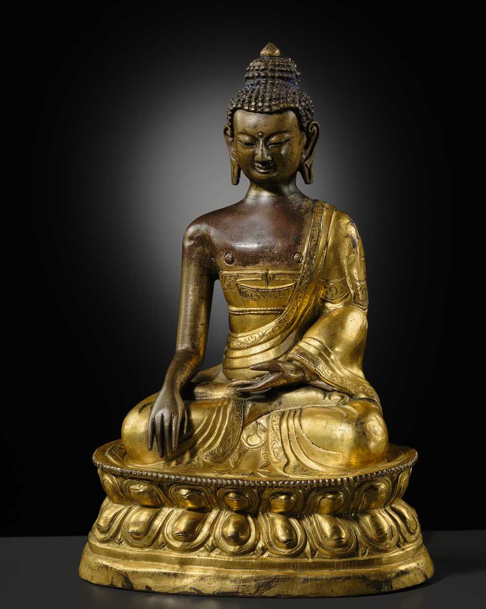 A GILT-BRONZE REPOUSSÉ FIGURE OF BUDDHA SHAKYAMUNI, INNER MONGOLIA, DOLONNOR MONASTERY, 18TH CENTURY