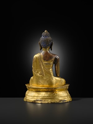 A GILT-BRONZE REPOUSSÉ FIGURE OF BUDDHA SHAKYAMUNI, INNER MONGOLIA, DOLONNOR MONASTERY, 18TH CENTURY