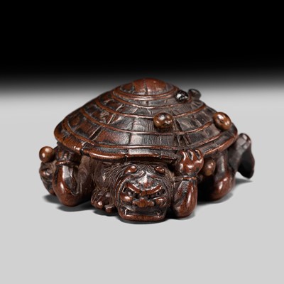 Lot 213 - A WOOD NETSUKE OF TWO COWERING ONI DURING SETSUBUN