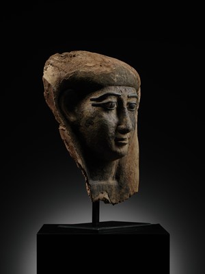 Lot 14 - A BRONZE AND LIMESTONE INLAID WOOD SARCOPHAGUS MASK, PTOLEMAIC PERIOD