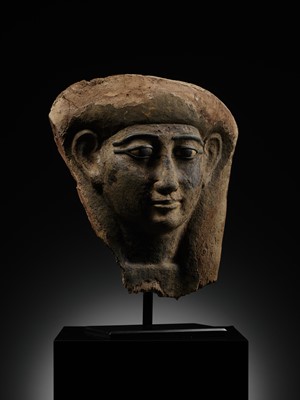 Lot 14 - A BRONZE AND LIMESTONE INLAID WOOD SARCOPHAGUS MASK, PTOLEMAIC PERIOD
